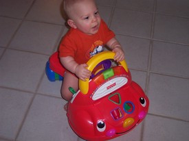 Sat Feb  4 14:16:34 2006
Andrew can scoot around on his little Fisher Price truck now, but he's still clumsy on it, so we have to watch him closely.