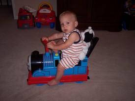 Sun Jul 30 17:10:58 2006

Most often Andrew pushes this train all around the house, but on this occasion he took a ride on it (mom pushed).