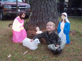 Sun 23 Dec 2007 02:47:03 PM

Andrew poses with the manger scene at Mema and Papa's house.