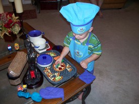 Sat 26 Apr 2008 06:15:42 PM

Cooking is now Andrew's favorite play activity, following cars, of course.