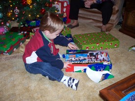 Tue 30 Dec 2008 10:51:34 PM

This picture is of Andrew opening his new remote control semi that also holds Matchbox and Hot Wheels cars