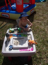 Thu 12 Feb 2009 01:14:30 PM

Andrew digging for dinosaurs in his sandbox.  It's really funny to hear him try to say paleontologist.