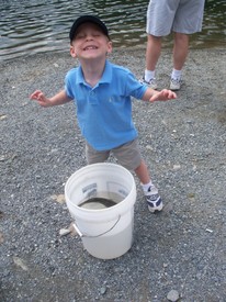 Tue 28 Jul 2009 11:38:03 AM

Andrew poses after helping net the first fish.