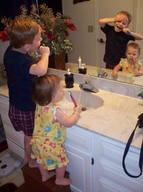 Tue 17 Aug 2010 08:21:08 PM

Andrew and Gracie brushing teeth together.