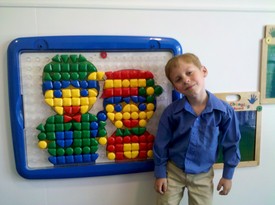 Sun 12 Sep 2010 12:29:21 PM

Andrew and Dad had to wait for Mom to finish nursery duty at church and so we passed the time with this wall puzzle.