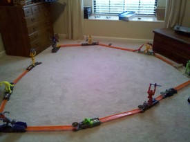 Sun 26 Dec 2010 10:07:08 AM

Andrew and Dad setup a hot wheels track that Nana and Papa got for him.