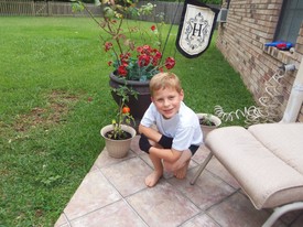 Mon 28 May 2012 07:04:37 PM

A small tomato that Andrew grew on the patio. He ate it the next day and said that it was great. He let Dad taste and he agreed!