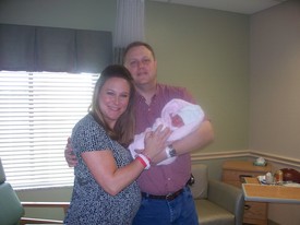 Thu 26 Mar 2009 11:57:06 AM

Mom, Dad, and Gracie in the hospital, right before we left to bring Gracie and Mom home.  Gracie weighed 6 lbs. 11 oz. when she came home.