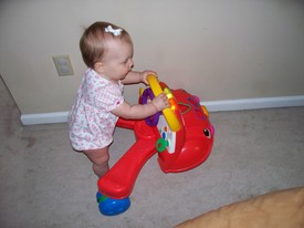 Sat 13 Mar 2010 08:14:43 AM

Gracie likes to push Andrew's old walk-behind car as well as her baby stroller.