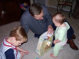 Wed 24 Mar 2010 07:20:27 PM

Mom, Dad, and Andrew gave Gracie gifts on the night of her birthday.