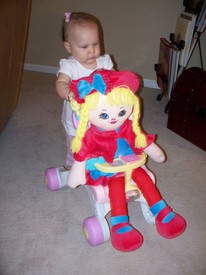 Sun 28 Mar 2010 11:51:50 AM

Gracie can't quite walk without support, yet, but she pushes her baby stroller all over the place.